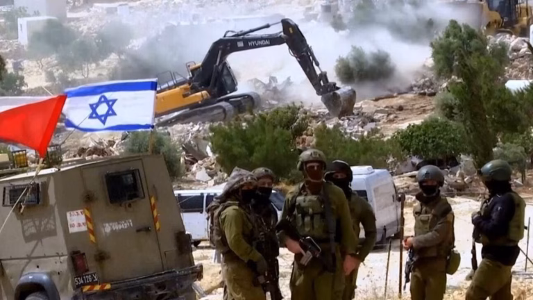Israeli forces raze large parts of a Bedouin village in the occupied West Bank, leaving numerous Palestinians homeless.
