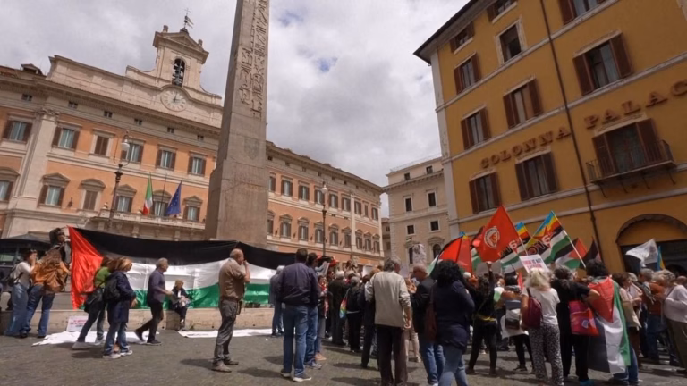 Protesting in front of Italy’s parliament building, many individuals come together to demonstrate support for Palestinians in Gaza.