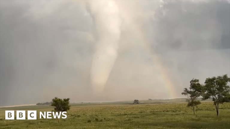 Incredible sight: colossal tornado intersects with a rainbow