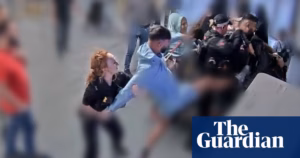 CCTV footage presented to jurors captures brothers accused of attacking police officers at Manchester airport | UK news