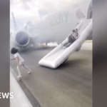 Evacuation via emergency slides at Denver airport as plane catches fire