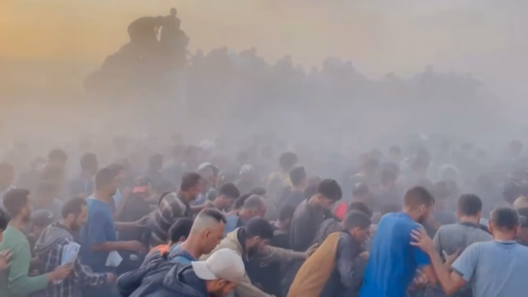 Scenes of chaos erupt as Palestinians in Gaza scramble for desperately-needed aid