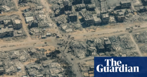 Gaza viewed from above: a landscape of desolation marked by debris, dust, and tombs.