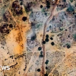 Satellite imagery reveals construction of a barrier encircling the embattled city in Sudan.