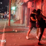 Serbian opposition supporters torch ruling party headquarters during ongoing protests on fifth night