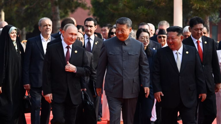 Russian President Vladimir Putin and North Korean leader Kim Jong Un line up next to Chinese President Xi Jinping at China’s grand military show of power.